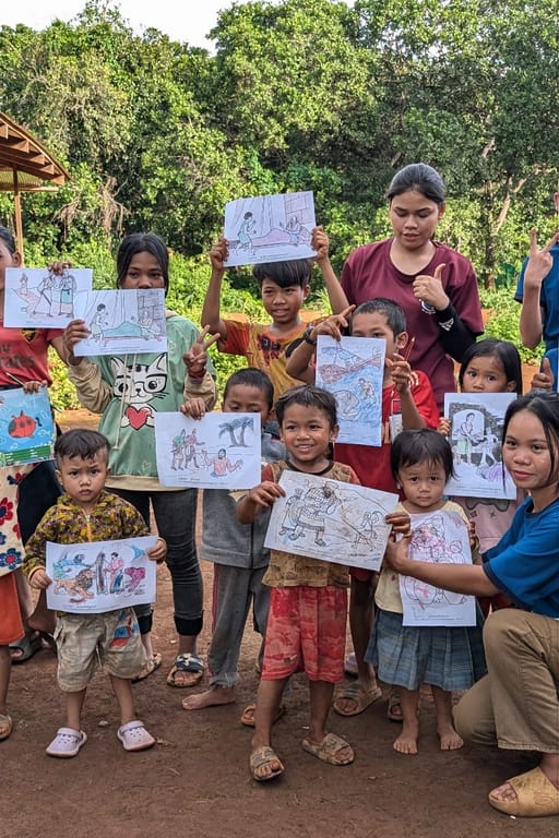 Local children showing off their colored pictures....