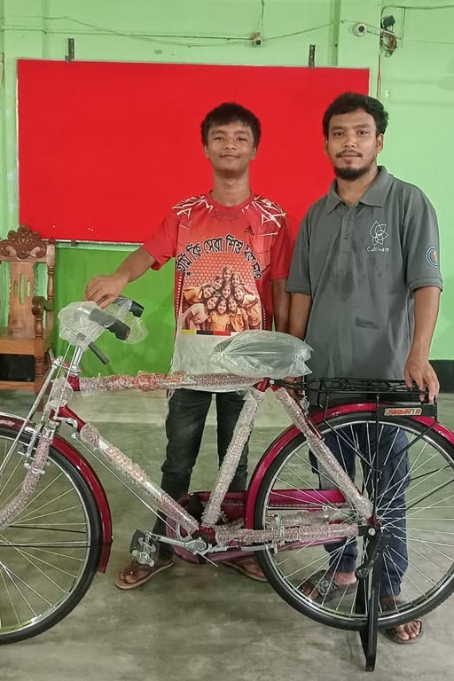 Providing a bicycle to a student to support his education and help him travel to school more easily.